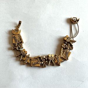 Vintage 11 Gold Tone Charm Bracelet